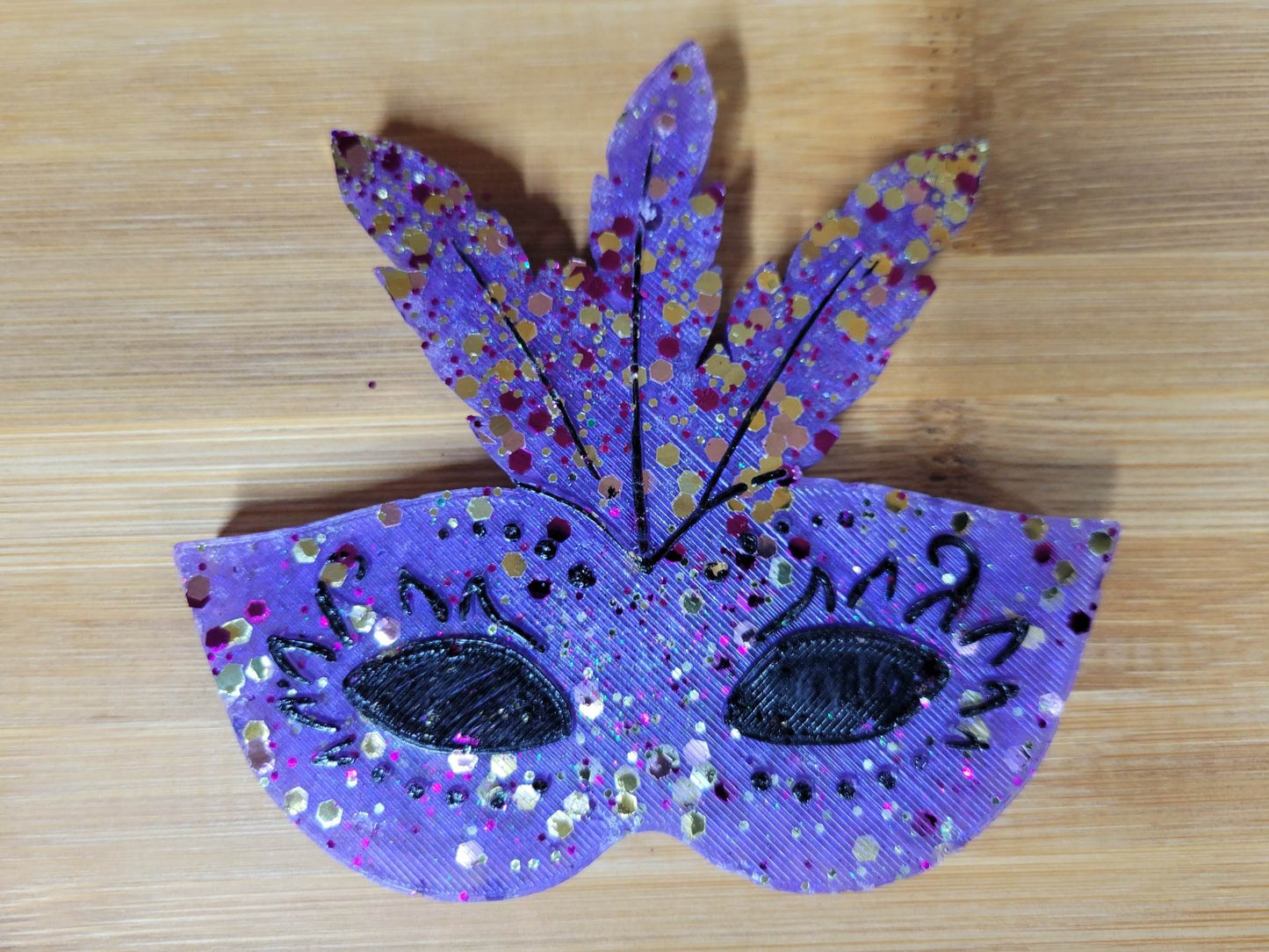 Mardi Gras mask with feathers